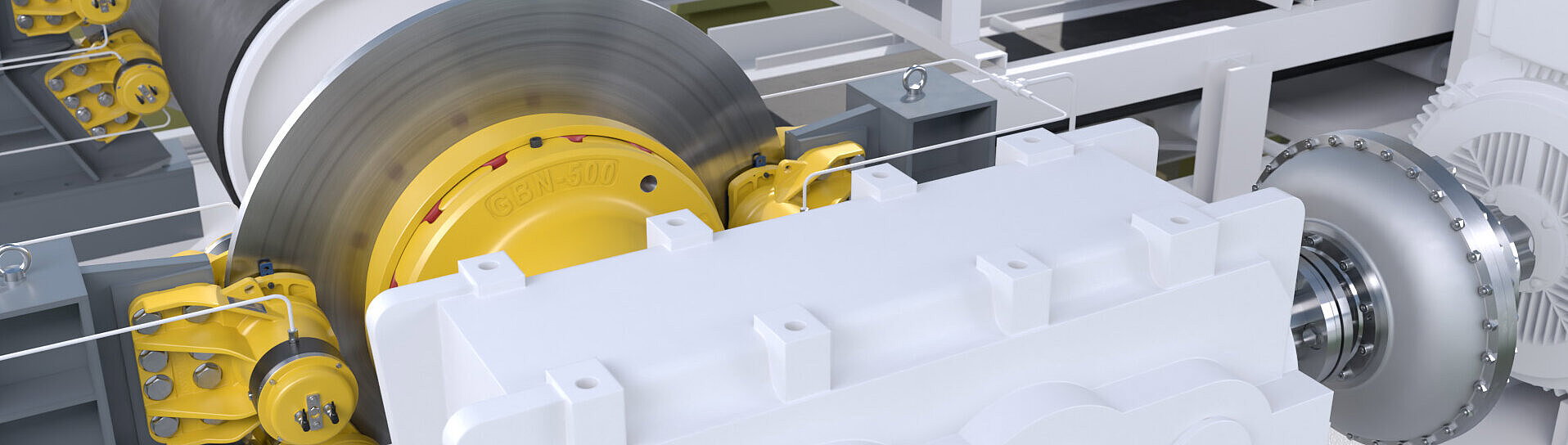 Nahaufnahme einer technischen Anlage mit großen Metallwalzen, gelben Bauteilen und weißen mechanischen Komponenten, im Hintergrund grüne Strukturen
